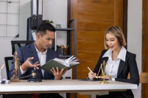 Legal bookkeepers going over numbers for their law firm client.